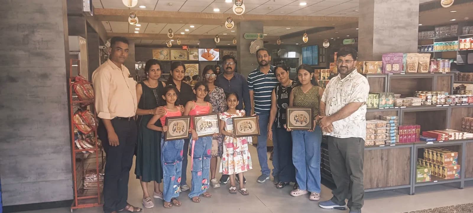 Happy Tourists Holding Framed Elephant Paintings in Store Tourists with Rajasthan Art