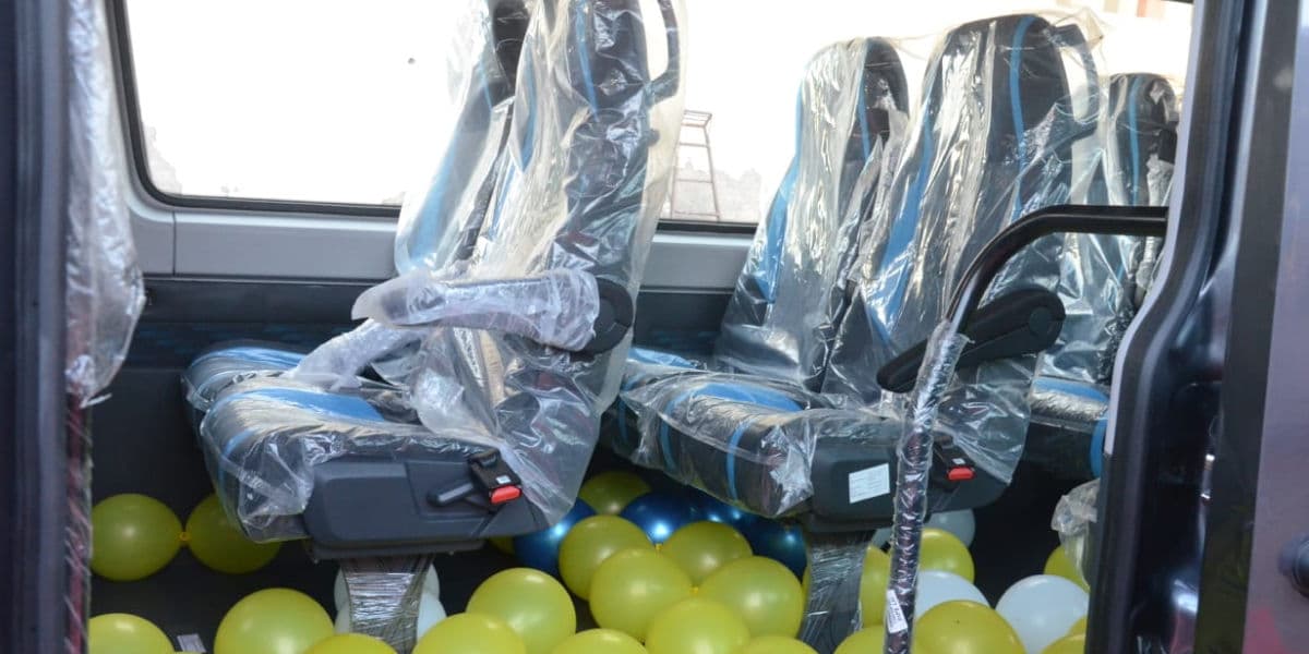 Left seating view of 17-seater Force Urbania rental vehicle Force Urbania left seating view